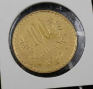 An Austrian 1927 100 shilling gold coin.