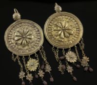 A pair of Indian? gold disc earrings, each with embossed decoration and foliate tassels, overall 3.