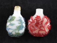 Two Chinese overlay glass snuff bottles, 19th / 20th century, the first carved with a crab amid