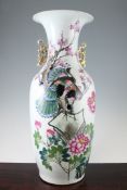 A large Chinese famille rose two handled baluster vase, early 20th century, painted with peacocks