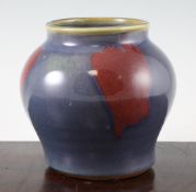 A Chinese Junyao style squat baluster vase, 19th century, the lavender glaze with sang de boeuf