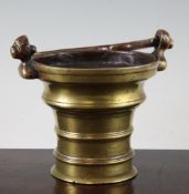 A 15th century German or Flemish brass Holy Water bucket, with a swing handle set into masks on each