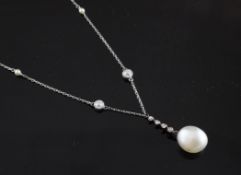 A white gold, cultured pearl and diamond set drop pendant necklace, the chain set with eight seed