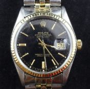 A gentleman`s 1990`s steel and gold Rolex Oyster Perpetual Datejust wrist watch, with black dial and