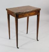 A George III rosewood combination games / writing table, with double hinged top and a baize lined