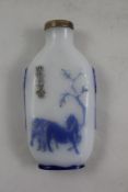 A Chinese blue and white overlay glass snuff bottle, Yangzhou school, 19th century, decorated with a