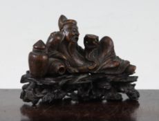 A Chinese bamboo carving of Li Bai, the drunken poet, 18th / 19th century, the figure reclining
