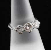 An 18ct white gold and three stone diamond ring, with a total approximate diamond weight of 1.