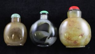 Three Chinese chalcedony snuff bottles, 19th / 20th century, all well hollowed, the first of