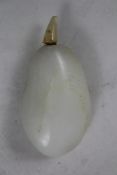 A Chinese white jade pebble snuff bottle, 1760-1860, with pale russet veining, 6.5cm.