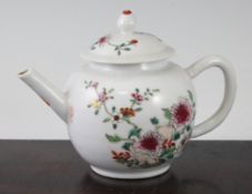 A Chinese famille rose globular teapot, Qianlong period, painted with flowers and rockwork, 18cm.