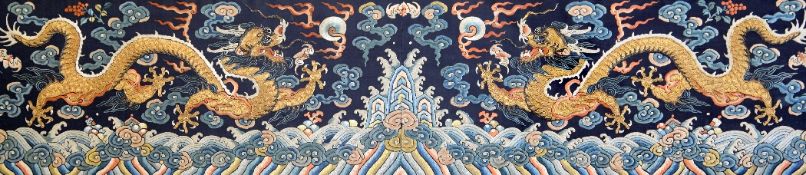 A Chinese embroidered silk and metal thread `dragon` panel, late Qing dynasty, finely woven with a