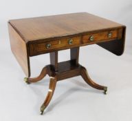 A Regency mahogany and rosewood crossbanded sofa table, with two drawers opposing two dummy drawers,