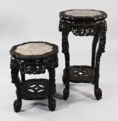 A late 19th century Chinese carved rosewood jardiniere stand, with octafoil rouge marble inset top