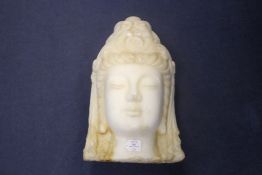 A large South East Asian white marble head of Guanyin, 52cm.