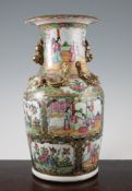 A Chinese Canton decorated famille rose vase, late 19th century, typically painted with reserves