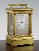 An early 20th century ormolu hour repeating carriage clock, with corinthian column case and movement