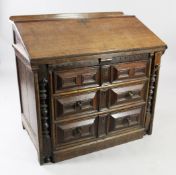 A late 17th / early 18th century oak bureau, the fall front with fitted interior over three long