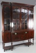 An Edwardian mahogany and boxwood inlaid breakfront display cabinet, with keyed pediment over four