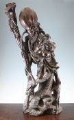A large Chinese wood figure of Shou Lao, holding his staff in his right hand, with a figure of a