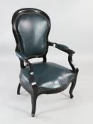 A 19th century French ebonised open armchair, with cartouche shape padded back and over-stuffed seat