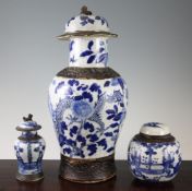 Three Chinese blue and white crackle glaze vessels and covers, 19th century, each with brown matt
