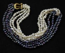 A Paloma Picasso for Tiffany & Co two colour baroque pearl torsade necklace, with 18ct gold `lyre`