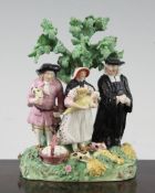 A Staffordshire pearlware Tithe pig group, c.1820, each of the figures standing before a tree, on