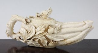 A Chinese ivory wine pot, first half 20th century, modelled as a finger citron, carved in relief