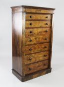 A Victorian burr walnut secretaire Wellington chest, the central secretaire drawer modelled as two