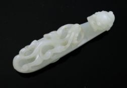 A Chinese white jade `dragon` belt hook, 18th / 19th century, carved in open work with a chi-
