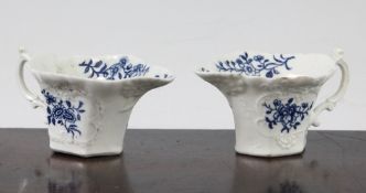 Two Worcester blue and white leaf moulded butter boats, c.1770, decorated throughout with floral