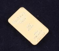 A Baird & Co 999.9 fine gold ingot, numbered F16418, 100 grams, approx. 1.75in.