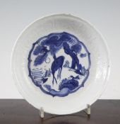 A Chinese late Ming blue and white dish, Wanli period, painted to the centre with a deer, pine