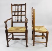 A harlequin set of eight spindle back and rush seat dining chairs, two with arms and six singles