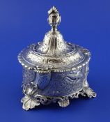 A Dutch silver tobacco box and cover, probably Hendrik Keyzer, Amsterdam 1765, circular, cast and