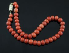 A Victorian single strand coral bead choker necklace, with gold hexagonal clasp with engraved date