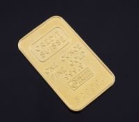 A Credit Suisse fine gold one ounce ingot, numbered 528003, 1.5in approx.