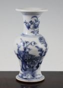 A Chinese Provincial blue and white baluster vase, 18th century, painted with flowers, rockwork