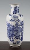 A Chinese blue and white rouleau vase, 19th century, painted with a vase of flowers, a bowl of fruit