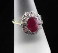 An 18ct gold Art Deco style ruby and diamond cluster ring, set with round and baguette cut stones,