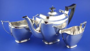 A 1930`s silver three piece tea set, of tapering rounded rectangular form, James Dixon & Sons Ltd,