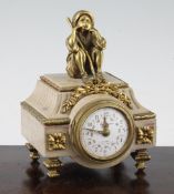 An early 20th century French ormolu mounted marble timepiece, surmounted with a figure of a seated