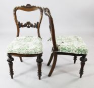 A set of five Victorian rosewood dining chairs, with acanthus leaf and floral scrolled spars, with