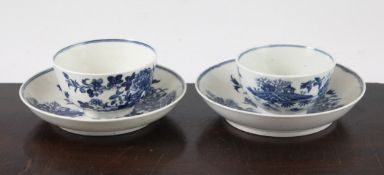 Two Worcester blue and white `Fence` pattern tea bowls and saucers, c.1775, shaded crescent marks to
