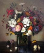 Vera Stevens (American, b.1895)oil on canvas,Still life of flowers in a glass vase,signed and