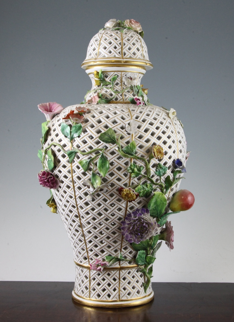 A large Meissen reticulated vase and cover, late 19th century, applied with fruit and flowers,