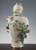 A large Meissen reticulated vase and cover, late 19th century, applied with fruit and flowers,