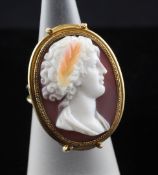 An 18ct gold and chalcedony cameo ring, of oval form, carved with the head of a lady to sinister,