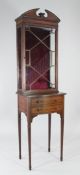 An Edwardian mahogany and satinwood crossbanded display cabinet, with break arch pediment, single